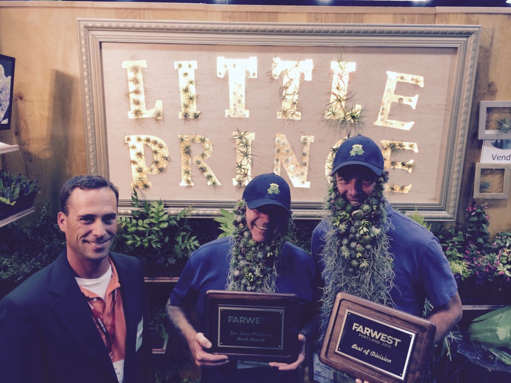 Mark Leichty and Ryan Seeley of Little Prince of Oregon Nursery accept the Far From Ordinary booth award from Farwest Show Chairman Ryan Basile.